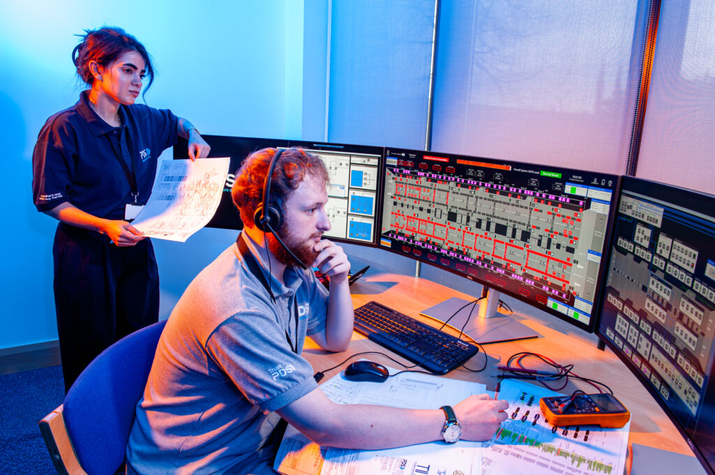 A PDS worker looking at the SCADA and CCTV screens in the control room.